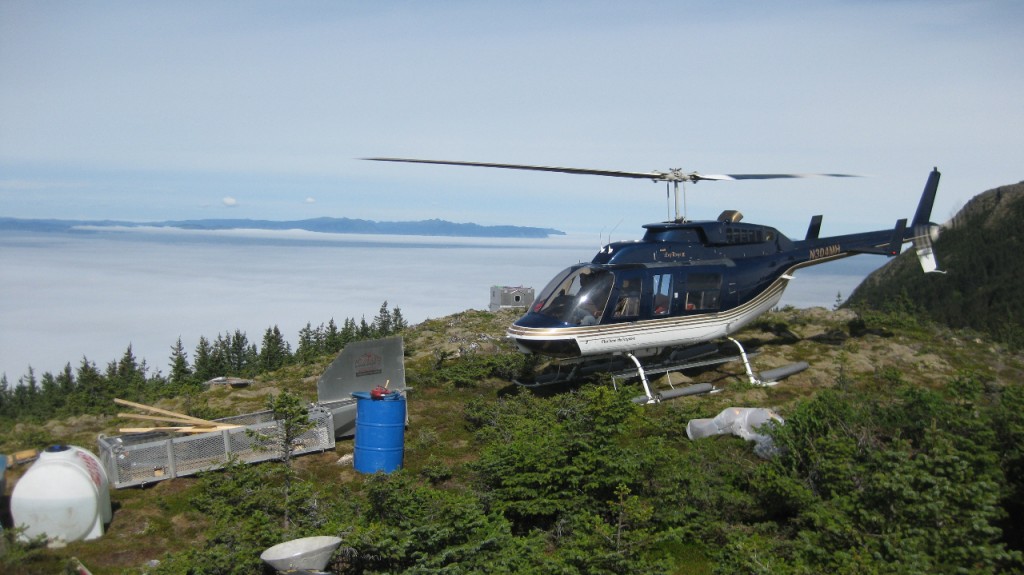 Helicopter Flying Over Mountains in Alaska						
